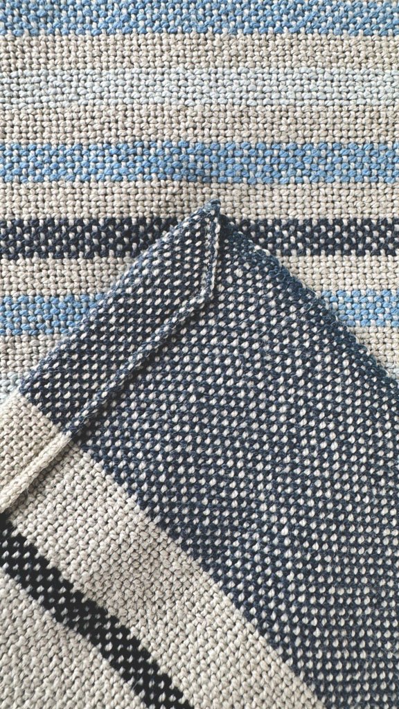 close up of grey and blue stripe towel