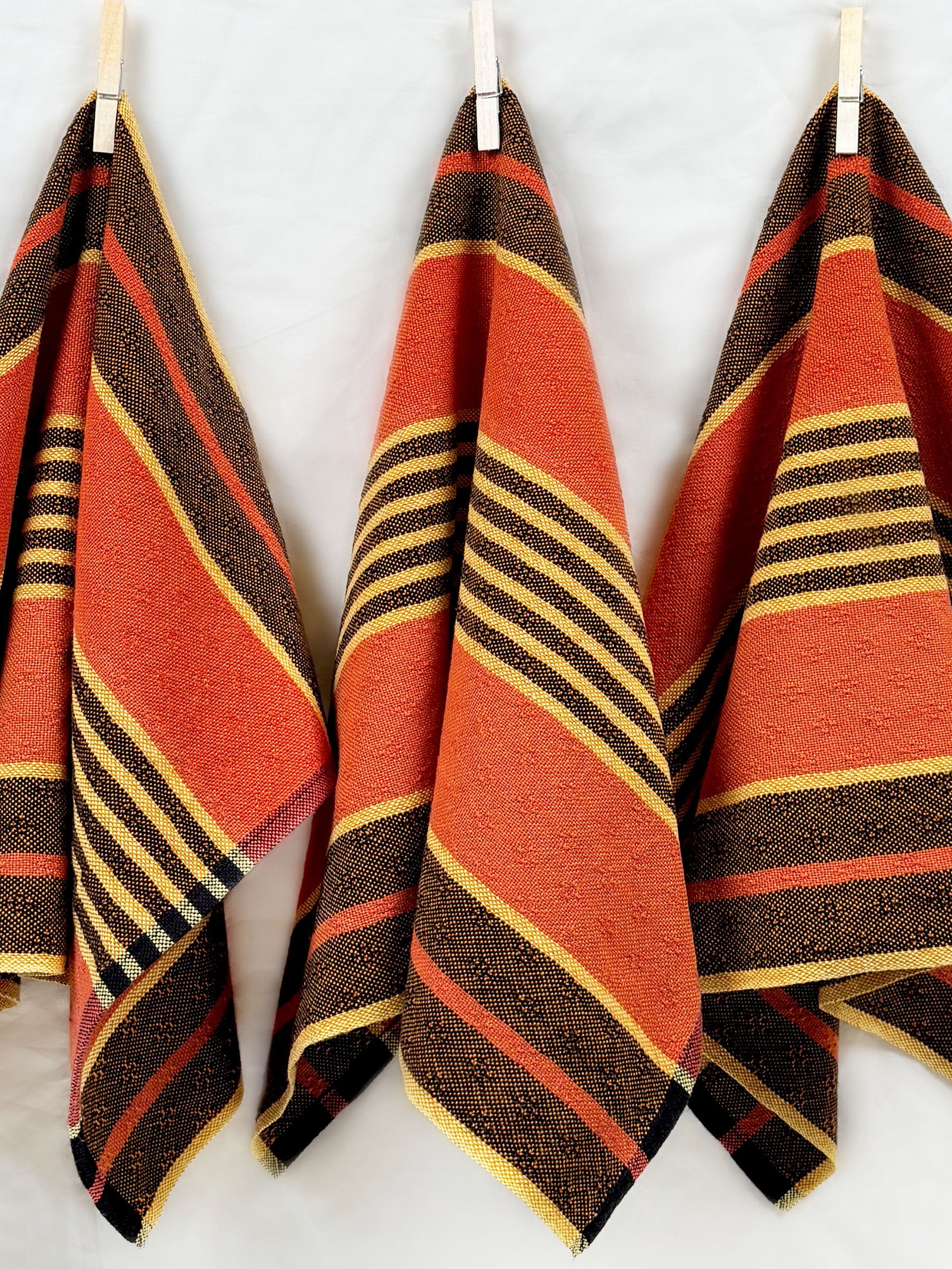 three hanging striped halloween tea towels