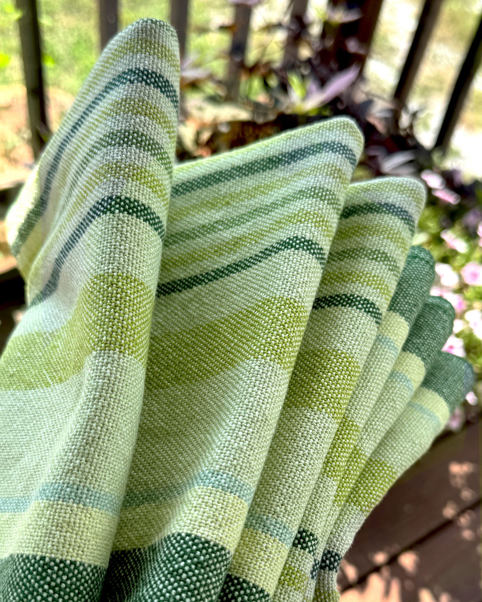 folded striped green towels