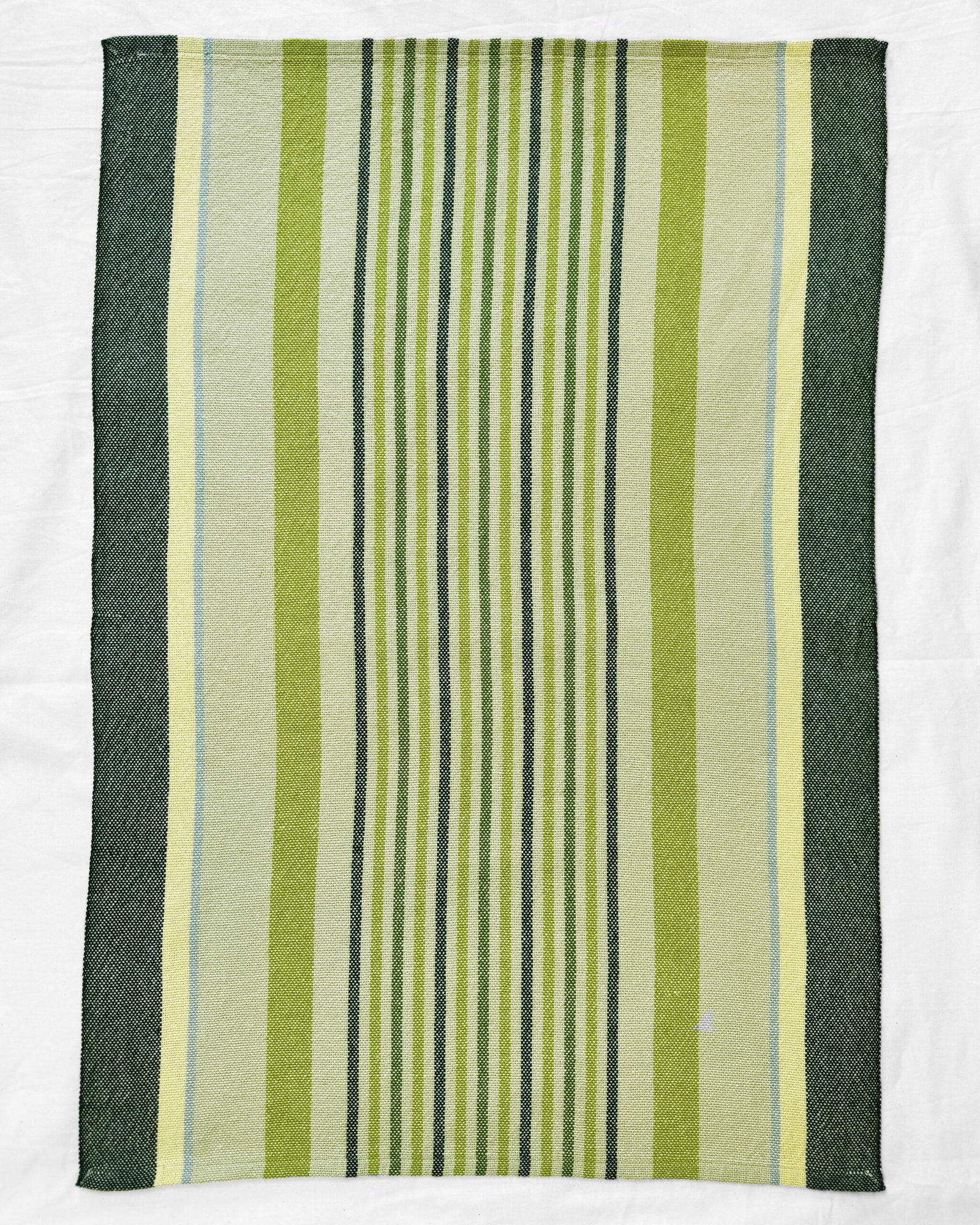green striped towel laying flat